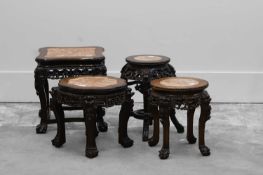 A Chinese carved hardwood urn stand,
