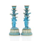 A pair of Sevres porcelain candlesticks,