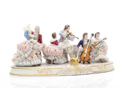 A Dresden lace porcelain orchestra figural group,