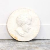 A white marble portrait plaque,