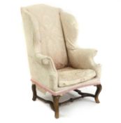 A George I walnut wingback armchair,