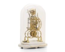 A brass skeleton clock with glass globe case,