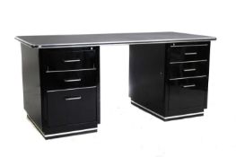 A black and chrome metal pedestal desk,