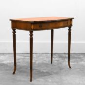 An inlaid mahogany bow fronted writing table,