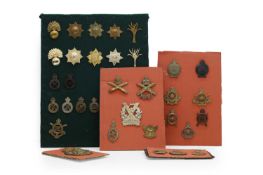 A selection of British Army cap badges of the Guards Division and the Royal Naval Division,