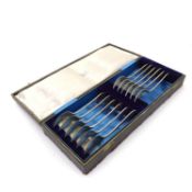 A collection of six silver forks and spoons,