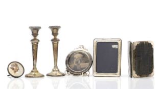 Three silver photograph frames,