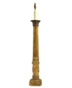 A carved giltwood torchere lamp,