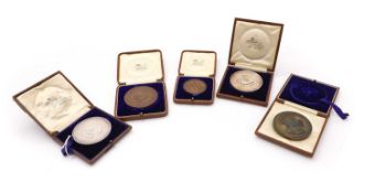 A collection of five Oxford University sports medallions, awarded to R D Clarke,