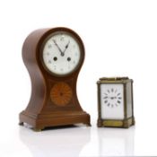 An Edwardian inlaid mahogany balloon-shaped mantel clock,