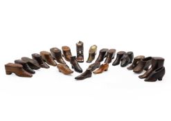 A group of treen shoes snuff boxes,