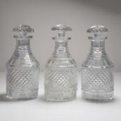 A set of three Regency cut glass decanters,