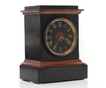 A French black slate and rouge marble mantle clock,
