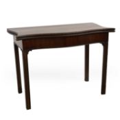 A George III mahogany serpentine card table,