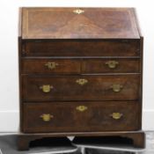 A George III burr wood and feather banded bureau,