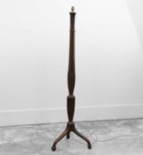 An oak standard lamp,