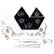 A collection of boxed Swarovski items,
