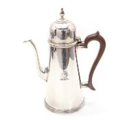 A silver coffee pot,
