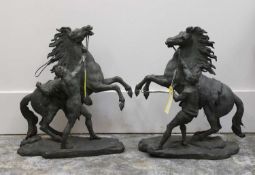A pair of bronze figures of the Marley horses,