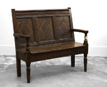 An 18th century and later oak settle,