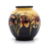 A William Moorcroft pottery 'Orchid' pattern vase,