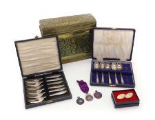 A set of six cased silver pastry forks,