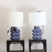 A pair of blue ceramic lamps,