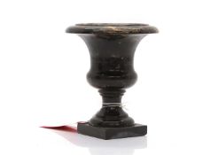 A black and pink marble urn,