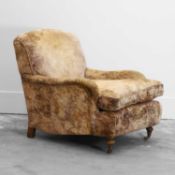 An upholstered armchair in the Howard & Sons ‘Bridgewater style,