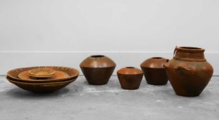 A collection of African pottery items,