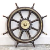 An oak and brass-mounted ship's wheel,