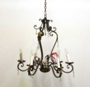 A wrought iron and gilt-metal chandelier,