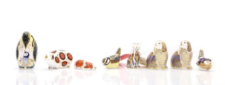 A collection of Crown Derby paperweights,