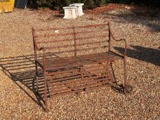 A Victorian wrought iron garden bench,