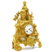 A gilt metal and marble mantel clock,
