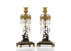 A pair of Regency style brass and patinated bronze table lustres,
