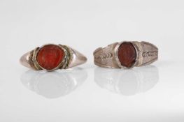 Two carnelian-set intaglio rings,