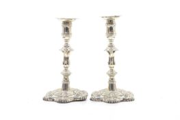 A pair of silver candlesticks,