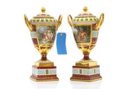 A large pair of Vienna porcelain urns and covers,