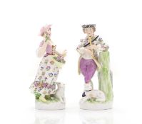 A pair of Meissen style figures,