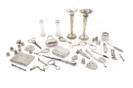 A collection of silver novelty items,