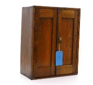 A small oak table cabinet,