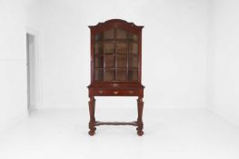 A mahogany cabinet-on-stand in the Queen Anne taste,