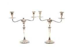 A pair of silver-plated candelabra,