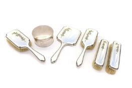 A set of silver and enamel dressing table items,