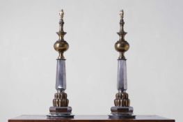 A pair of large polished brass and steel table lamps,
