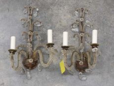 A pair of glass wall lights,