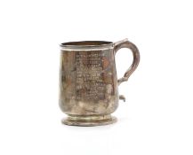 A silver presentation mug,