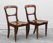 A pair of mahogany hall chairs,