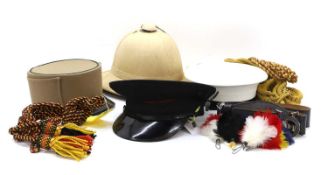 A collection of Crown Agents pattern hats,